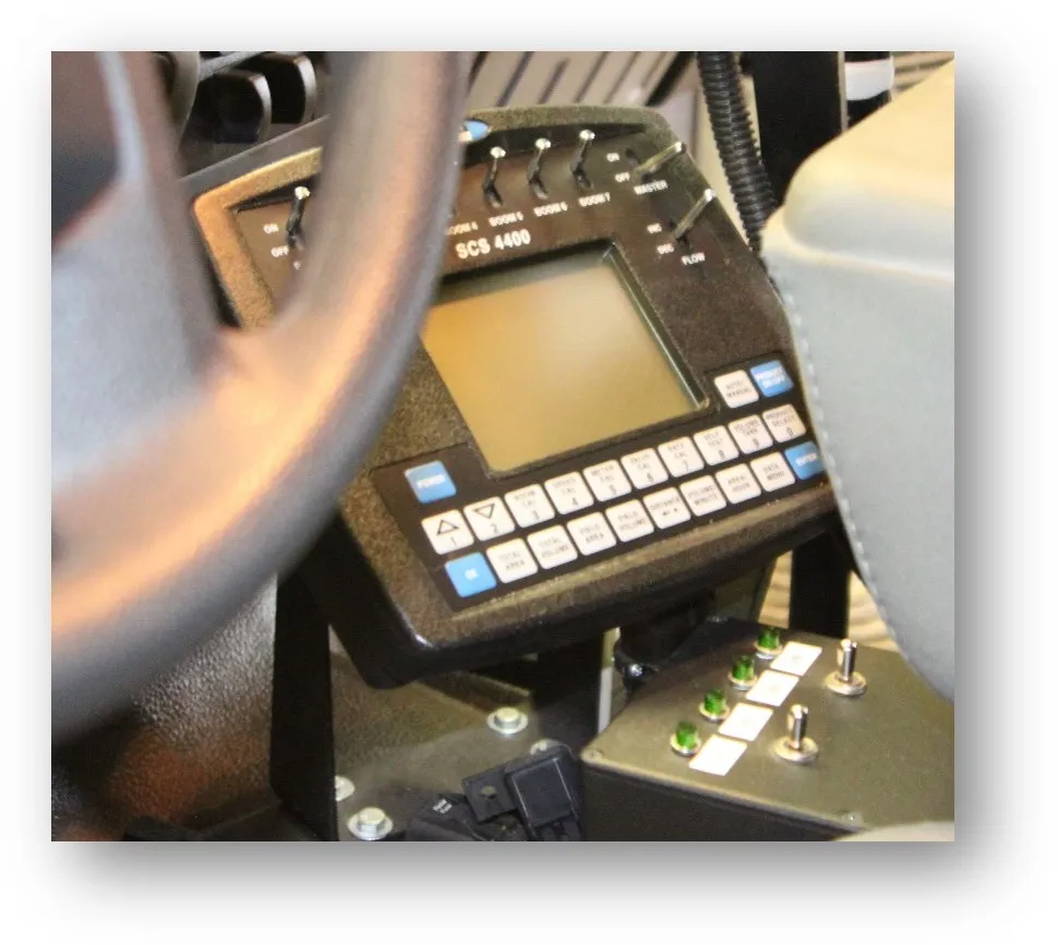 Raven SCS 4400 spray controller mounted beside the steering wheel in a spray truck
